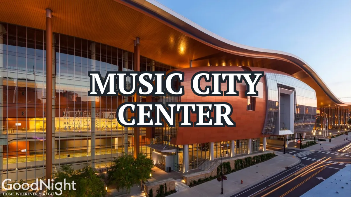 This image features the distinctive curved roof and large glass windows of the Music City Center, with the entrance area clearly visible. The architecture is modern and energetic, setting the tone for conventions and business events.