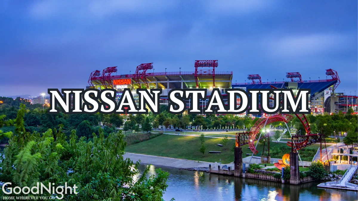 This image features Nissan Stadium against the riverside backdrop, with bridges and green park areas nearby. The scene includes activity and movement, hinting at major events, concerts, and sports games that draw crowds to the area.